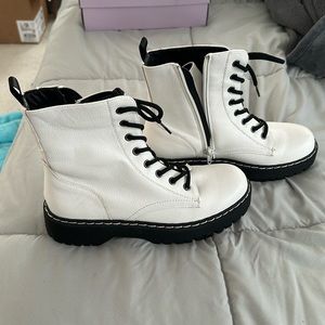 White boots with black bottom